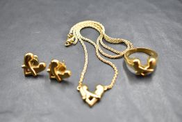 An 18ct gold three piece jewellery suite by Boodle & Dunthorne in the 1990's Hug design,