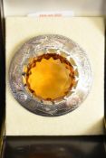 A large silver Scottish style brooch with central citrine style paste stone, diameter approx 64mm