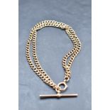 A 9ct rose gold double chain bracelet having attached T bar, approx 14.8g