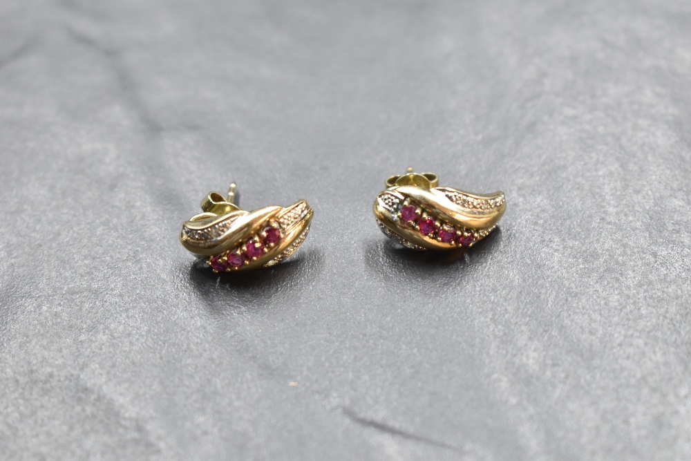 A pair of 9ct gold stud earrings having ruby and diamond chip decoration to moulded panels, approx - Image 2 of 2