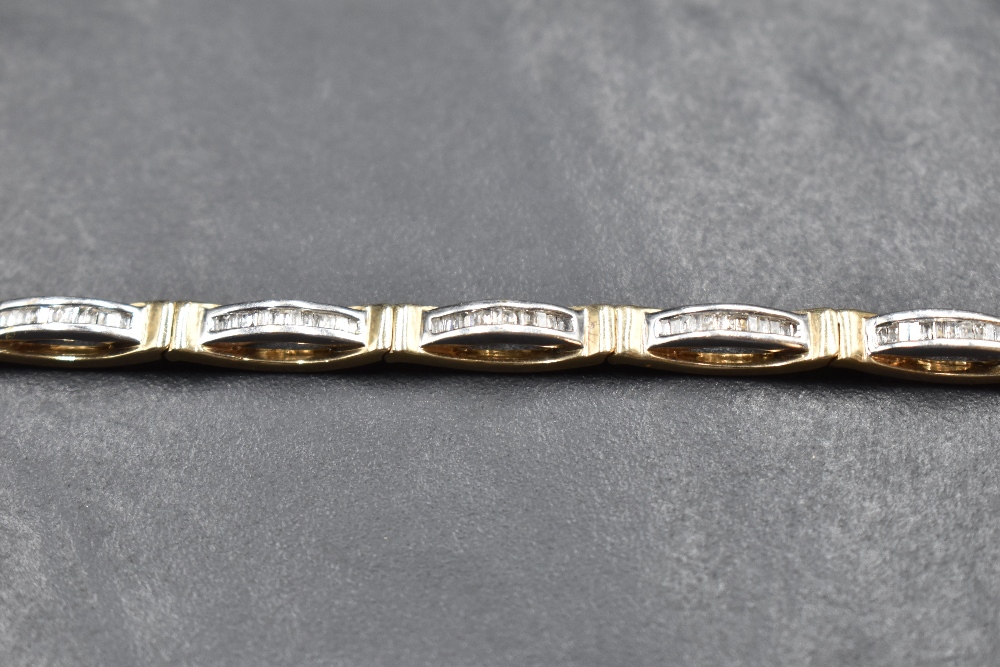 A 9ct white and yellow gold articulated bracelet having eleven panels each containing twelve small - Image 2 of 2