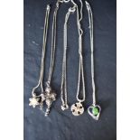 Four silver & white metal pendants with chains including filigree, and a separate chain