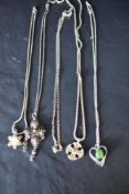 Four silver & white metal pendants with chains including filigree, and a separate chain