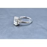 A fine and impressive platinum and Phoenix-cut diamond ring, the central claw-set phoenix-cut