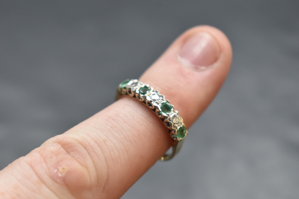 An emerald and diamond half eternity ring having an illusionary setting on a 9ct gold loop, size R & - Image 2 of 2