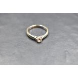 A diamond solitaire ring having diamond set mount, total approx 0.45ct in a 4 claw setting on an