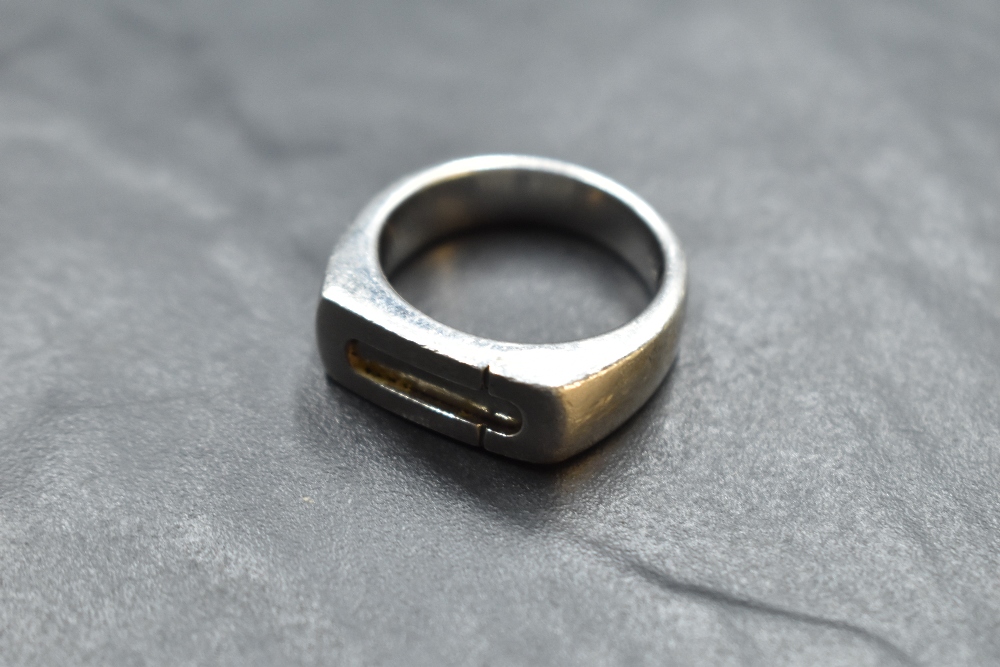 A 1970's silver ring by Pierre Cardin having architectural style decoration and stamped 20 to
