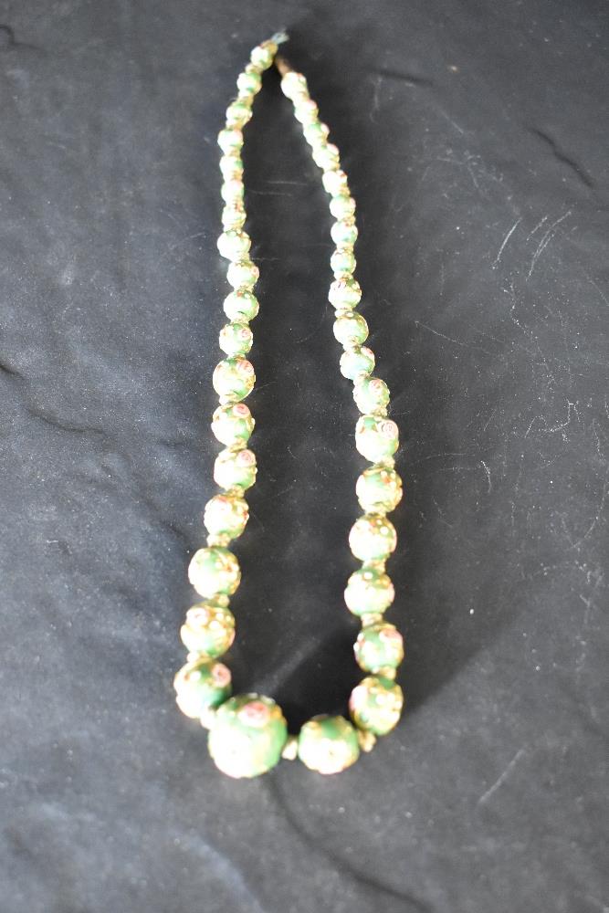 A short string of Cloisonne style green porcelain beads, possibly Chinese, approx 18'