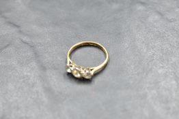 A diamond trilogy ring, total approx 1ct in a claw set mount on an 18ct gold loop, size N & approx