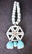 A Butler & Wilson 1970's statement necklace having turquoise style beads and stones, with original