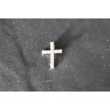 A small diamond cross pendant having brilliant and baguette cut diamonds in a 14ct white gold mount,