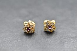 A pair of 9ct gold stud earrings having amethyst and cubic zirconia cross detail, approx 3g