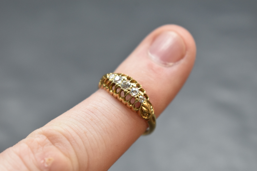 A five stone graduated diamond ring in a boat claw set mount on an 18ct gold loop, size P & approx - Image 2 of 2