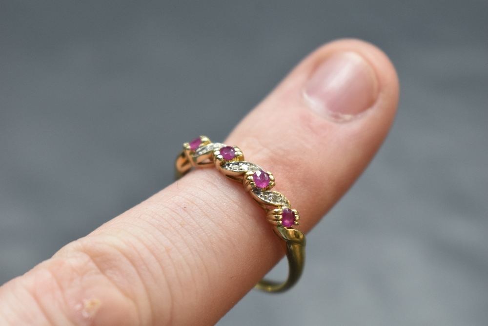 A ruby and diamond chip twist ring on a 9ct gold loop, size T and approx 2.2g - Image 2 of 2