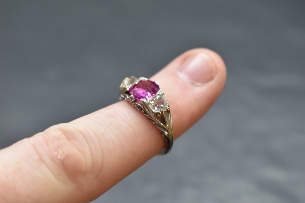 A Victorian ruby and diamond ring, the central ruby approx 1.25ct flanked by two old cut diamonds, - Image 2 of 2