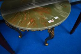 An onyx and gilt coffee table having circular top