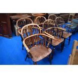 A set of six 19th Century Windsor chairs having crinoline stretchers