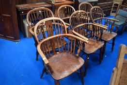 A set of six 19th Century Windsor chairs having crinoline stretchers