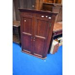 A George III oak wall corner cupboard