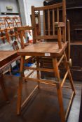 A vintage stained frame high chair