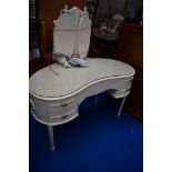 A Louis IV style kidney shaped laminate dressing table