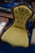 A Victorian mahogany nursing chair having knurl frame and gold dralon upholstery