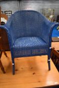 A Lloyd Loom tub chair in blue