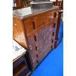 A vintage bedroom chest of five drawers