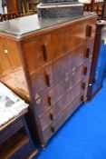 A vintage bedroom chest of five drawers