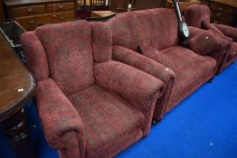 A 1930s design three piece lounge suite having later damask style upholstery