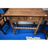 A nice quality reproduction oak side table having two frieze drawers