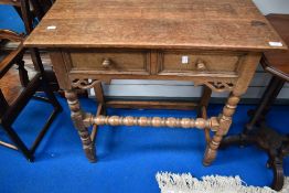 A nice quality reproduction oak side table having two frieze drawers