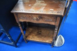 A vintage Priory style hall table with frieze drawer