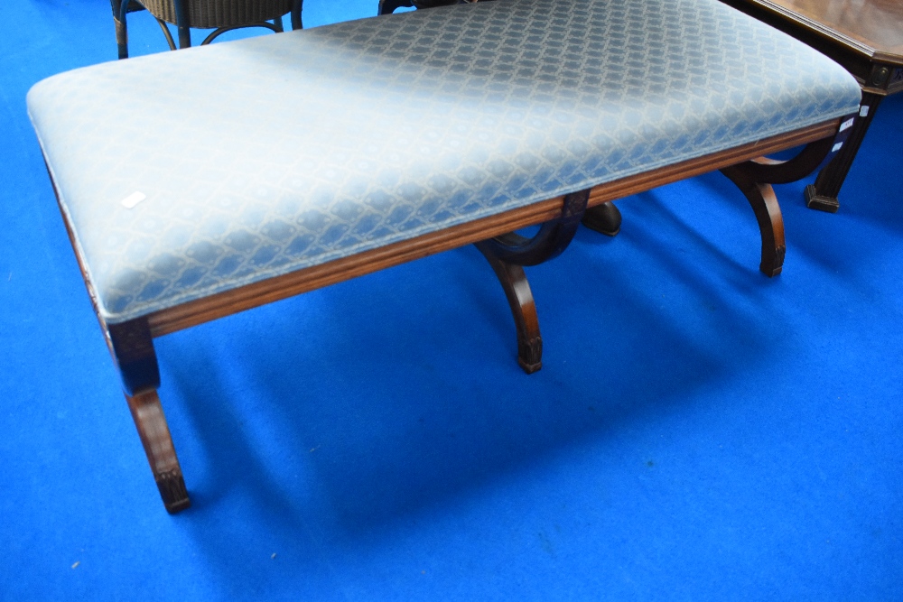 A nice quality reproduction banquette having savanarola type legs