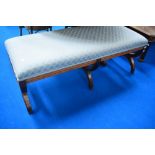 A nice quality reproduction banquette having savanarola type legs