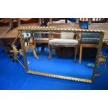 A gilt frame wall mirror having urn and swag decoration