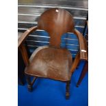 An interesting mid 20th Century part oak carver chair having ply back and solid seat on turned