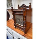 A 19th Century oak cased mantel clock having silvered dial named for W Brown, Sheffield