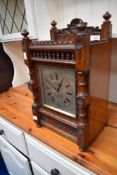 A 19th Century oak cased mantel clock having silvered dial named for W Brown, Sheffield