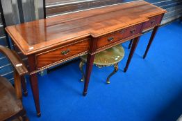 A good quality reproduction yew wood breakfront console table having square tapered legs and spade