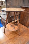 A 19th Century Gypsy style occasional table having bamboo effect mahogany legs