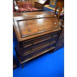 An early 20th Century oak bureau having barley twist frame