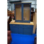 A large kitchen or similar display unit with base cupboards, blue/grey and beech effect finish