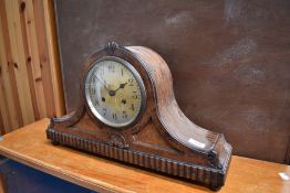 An early 20th Century oak cased Napoleon mantel clock