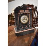 A Victorian black slate mantel clock