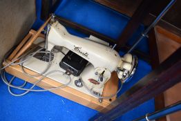 A vintage Oresta electric sewing machine