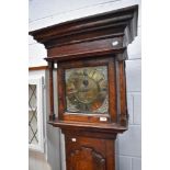 An 18th Century rustic cased long cased clock having 30 hr movement and brass dial named for Tho