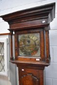 An 18th Century rustic cased long cased clock having 30 hr movement and brass dial named for Tho