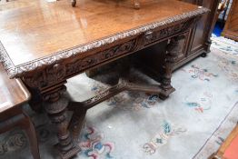 A 19th Century oak side or breakfast table having extensively carved design