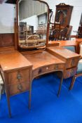 A 19th Century mahogany dressing table having large brass handles and inlaid decoration, width
